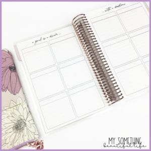 inside of planner; 12 boxes on page with pen pouch next to book